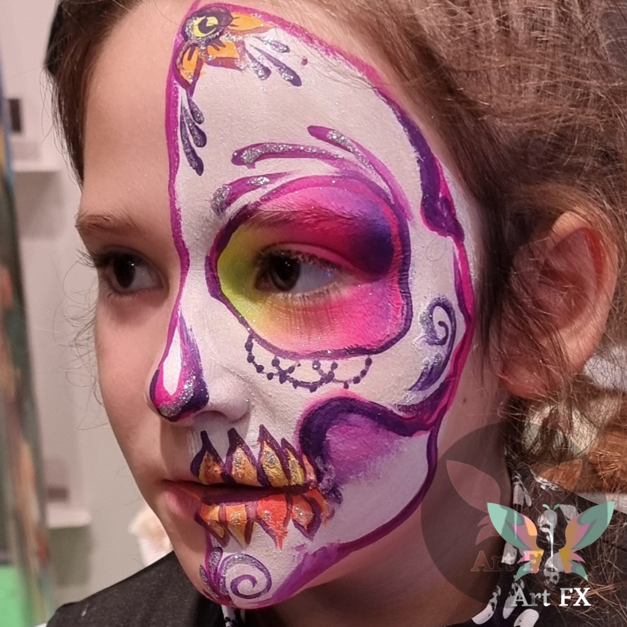 Men's spooky skull face painting with exposed teeth detail