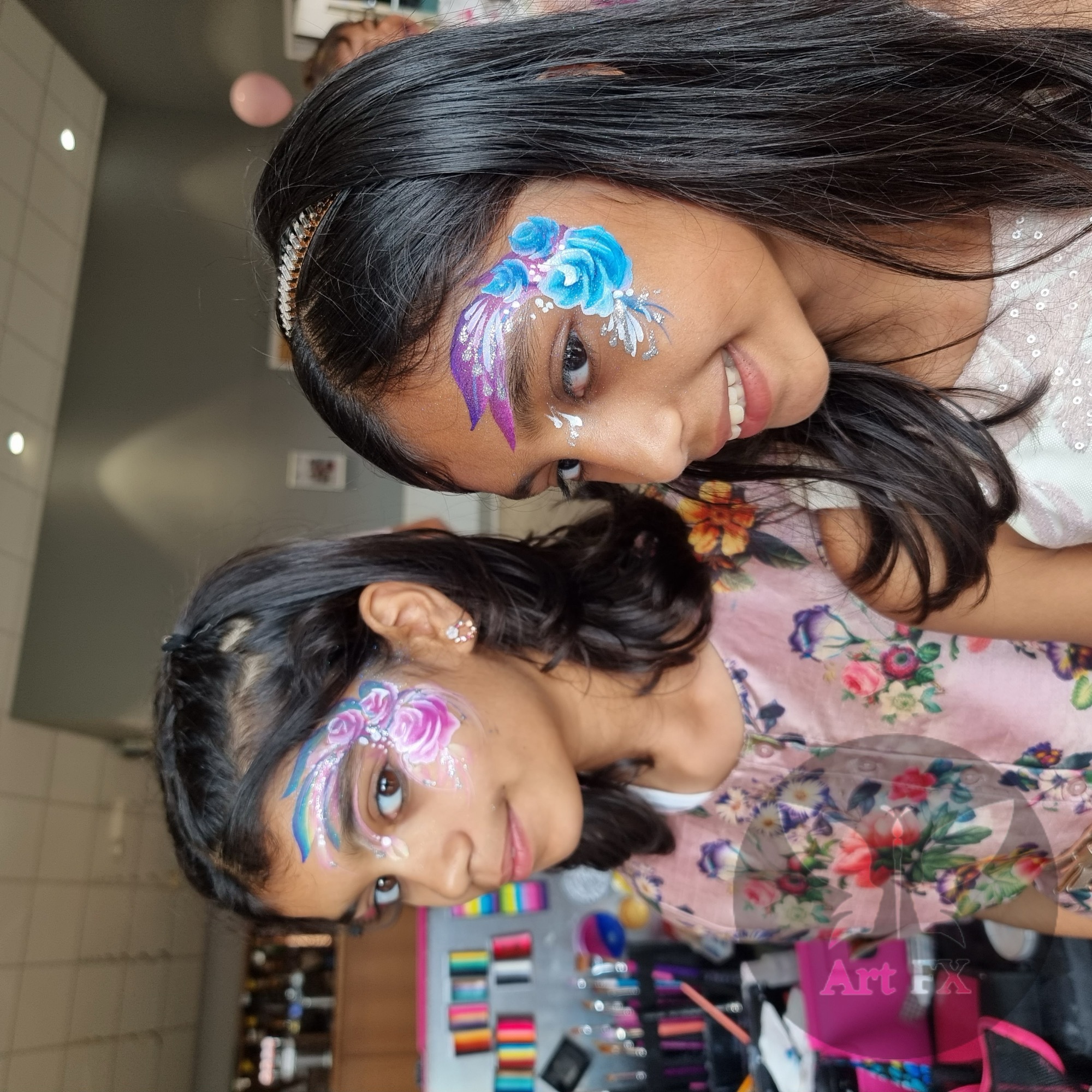 Young boy showcasing a red and black web-hero half face painting design